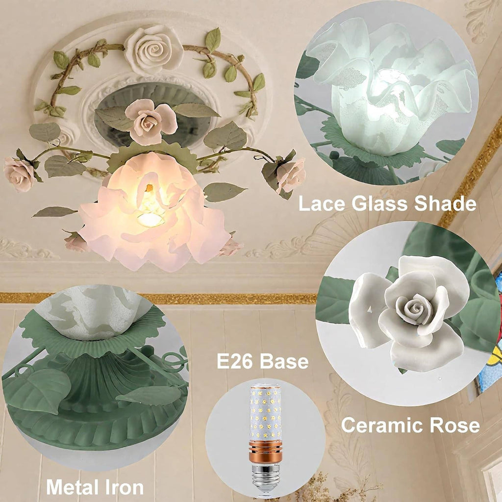 Green lace glass shade with white ceramic rose detail and leaf accents on metal base