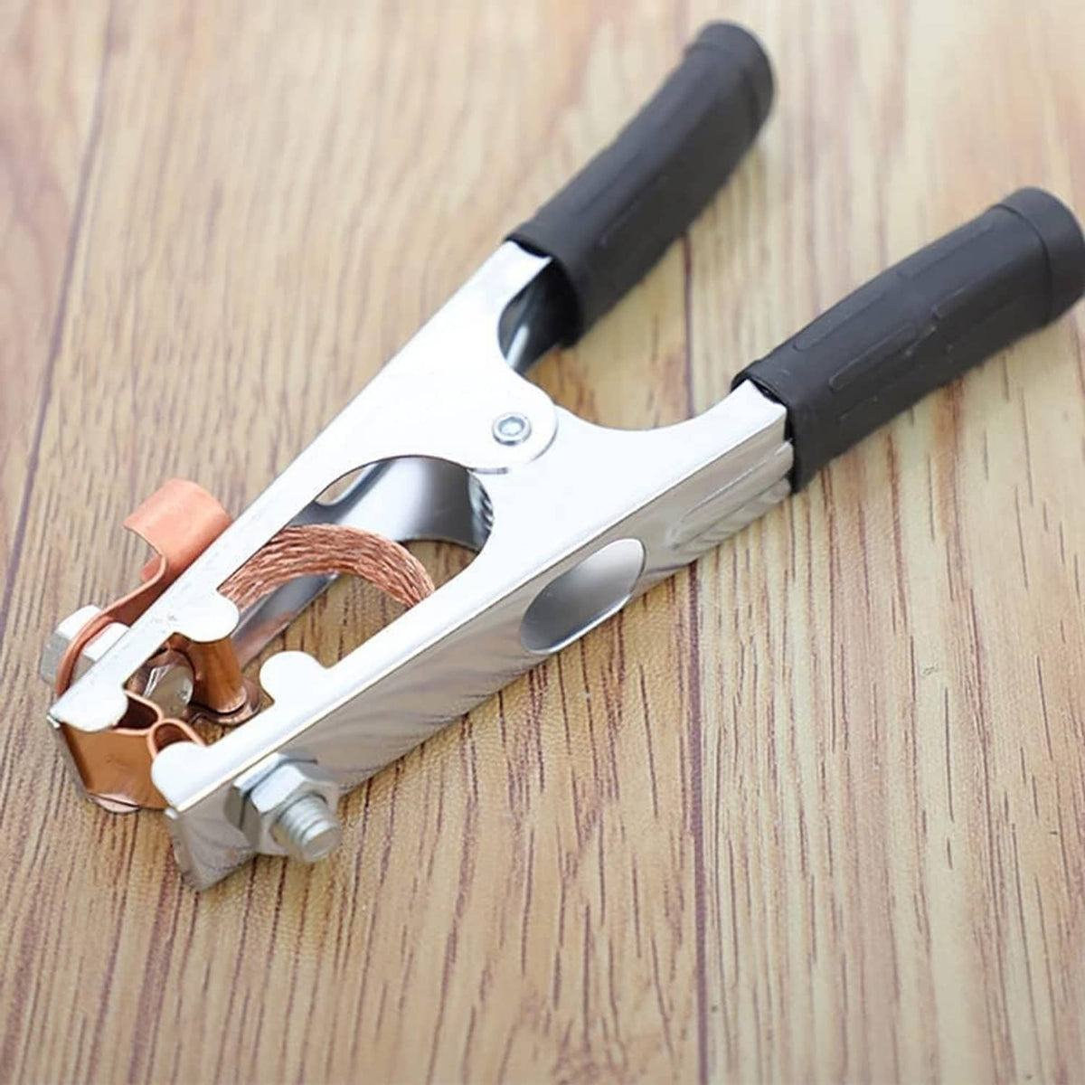 Grounding cable clamp with copper braid and black insulated grip handle