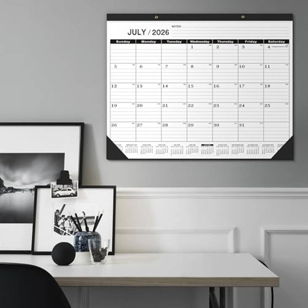 Wall-mounted desk calendar for July 2026 with black top bar and monthly date grid