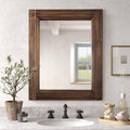 Rustic rectangular wooden wall mirror with dark brown spliced frame, clear glass reflection.