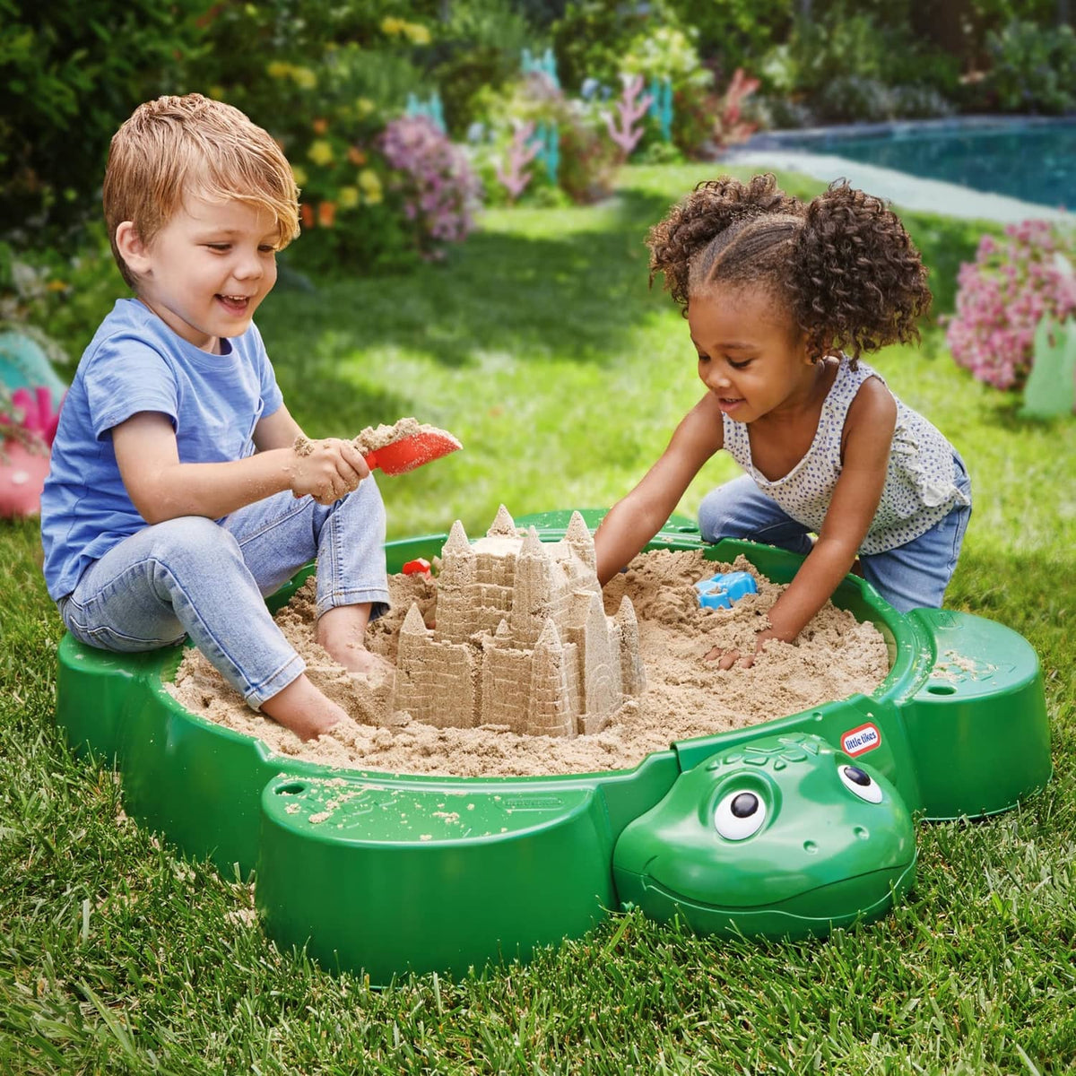 Green turtle sandbox with open bowl and sand play molds