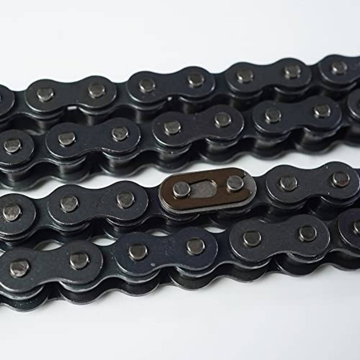Close-up of black roller chain plates and pins with hollow rollers