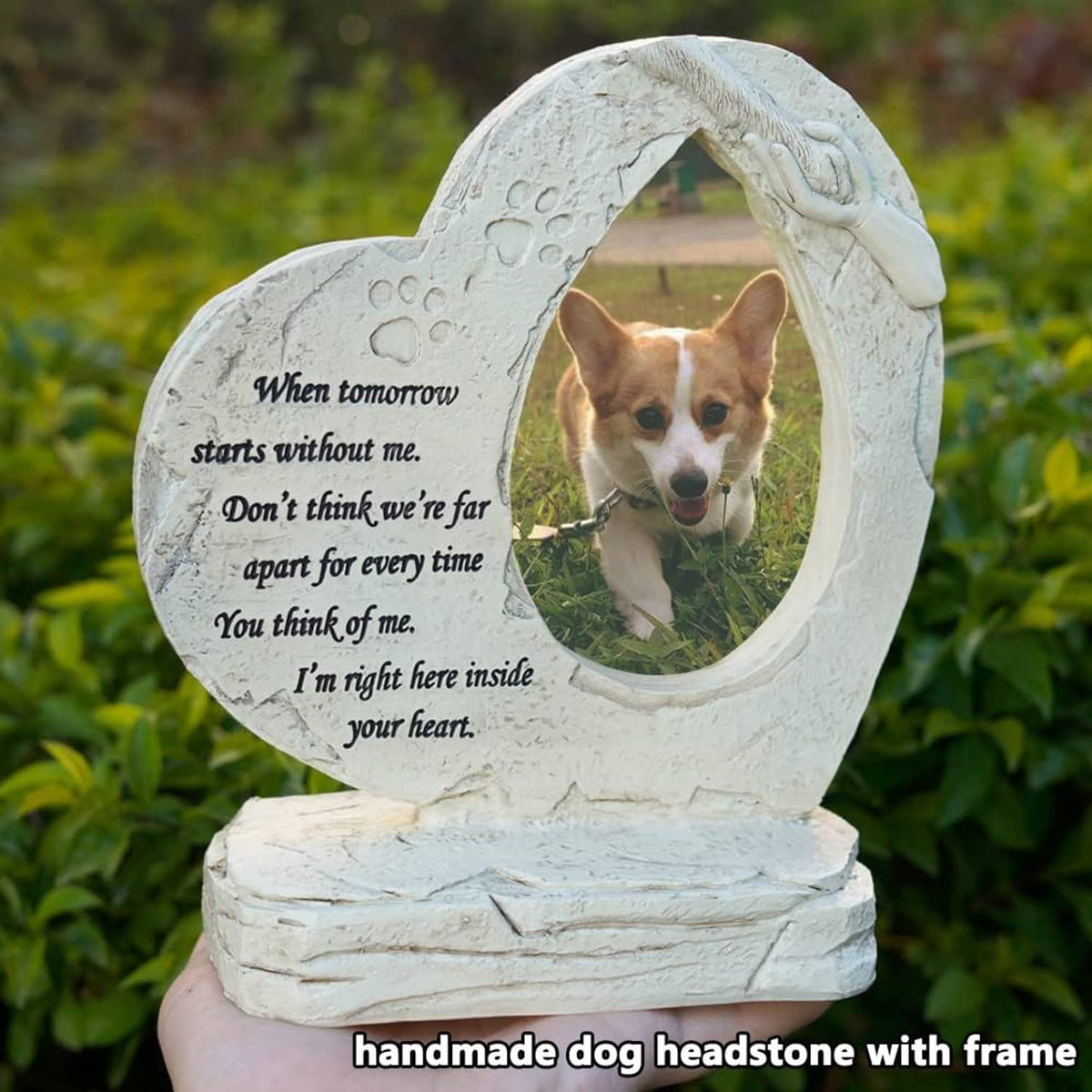 White heart-shaped dog headstone with oval photo frame and paw-print details