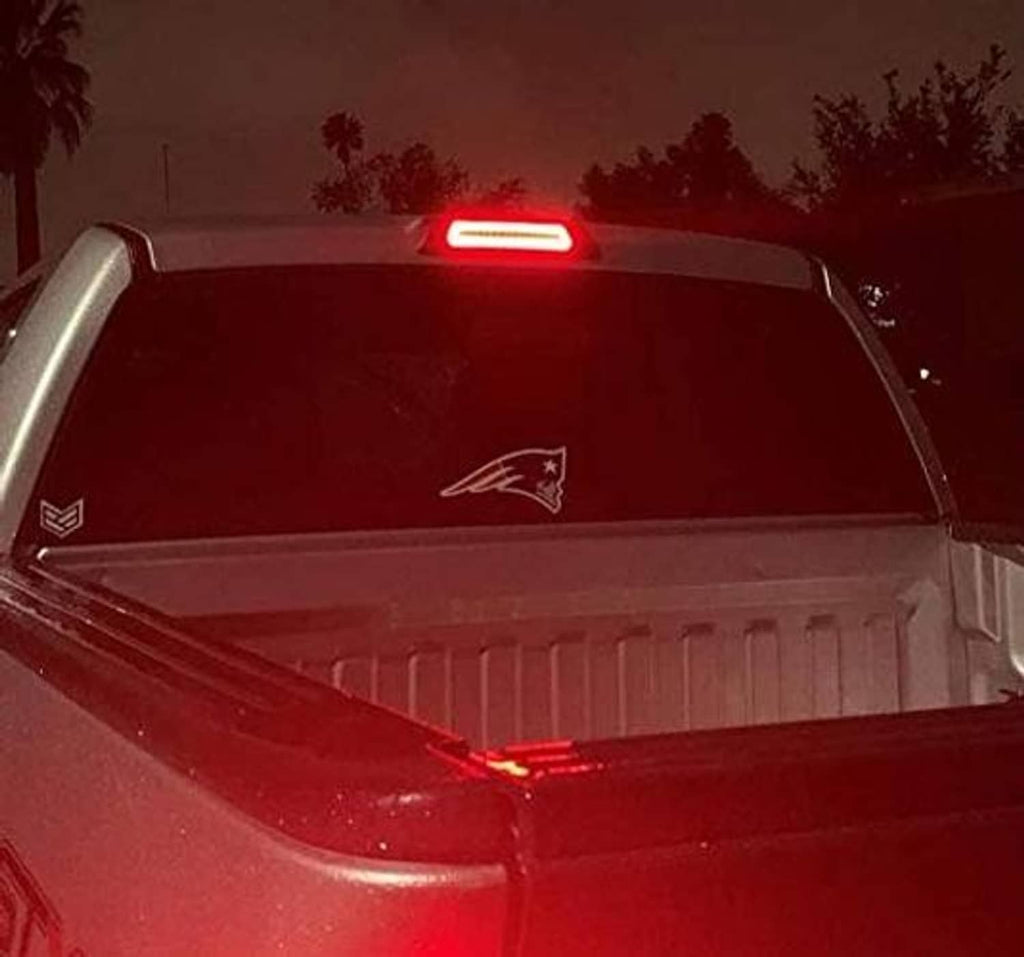 Close-up of red LED high mount third brake light with clear lens strip