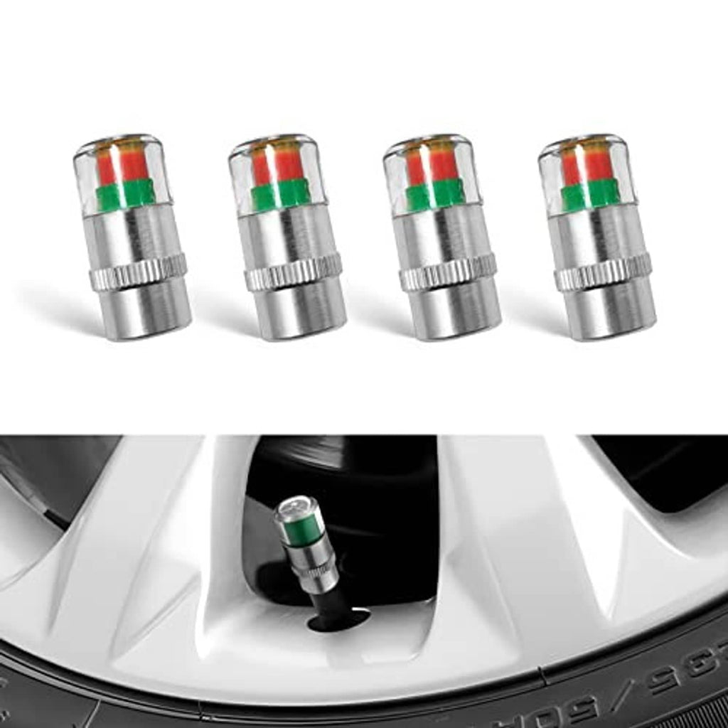 Metal tire valve stem cap with red-and-green indicator band on a car wheel