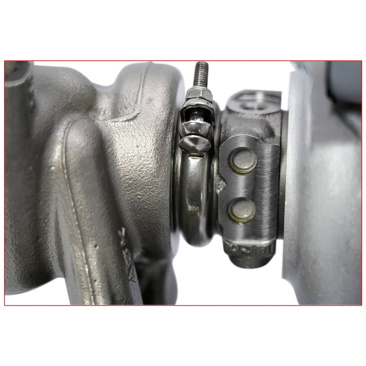 Turbocharger connection area with bolts and metal actuator detail