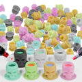 Mixed-color silicone tattoo ink cups with skull-shaped bases, 200-pack assortment.
