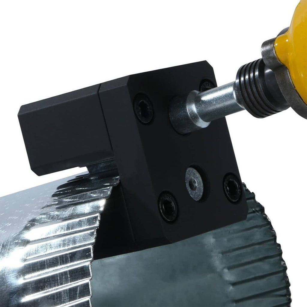 Black crimper head positioned on sheet metal with steel driver bit attached