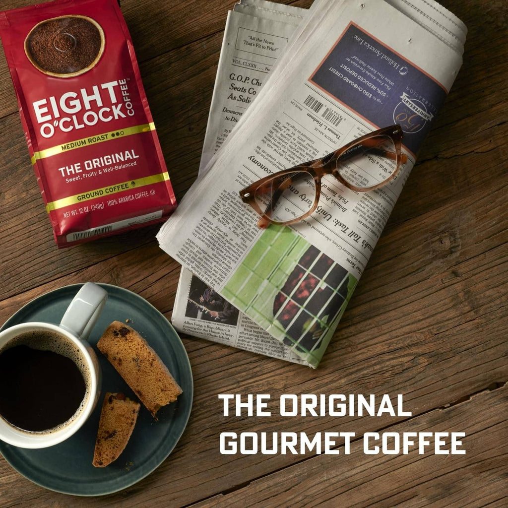 Medium roast coffee package with brewed cup and coffee grounds on a plate