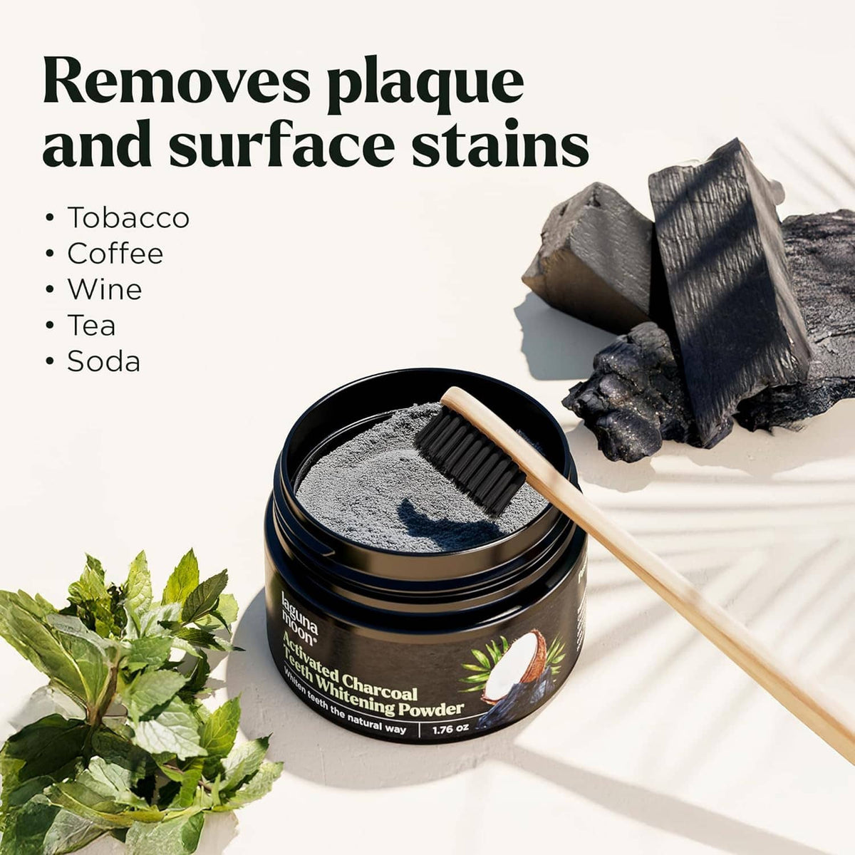 Charcoal whitening powder jar with toothbrush and scattered powder, black-and-gray