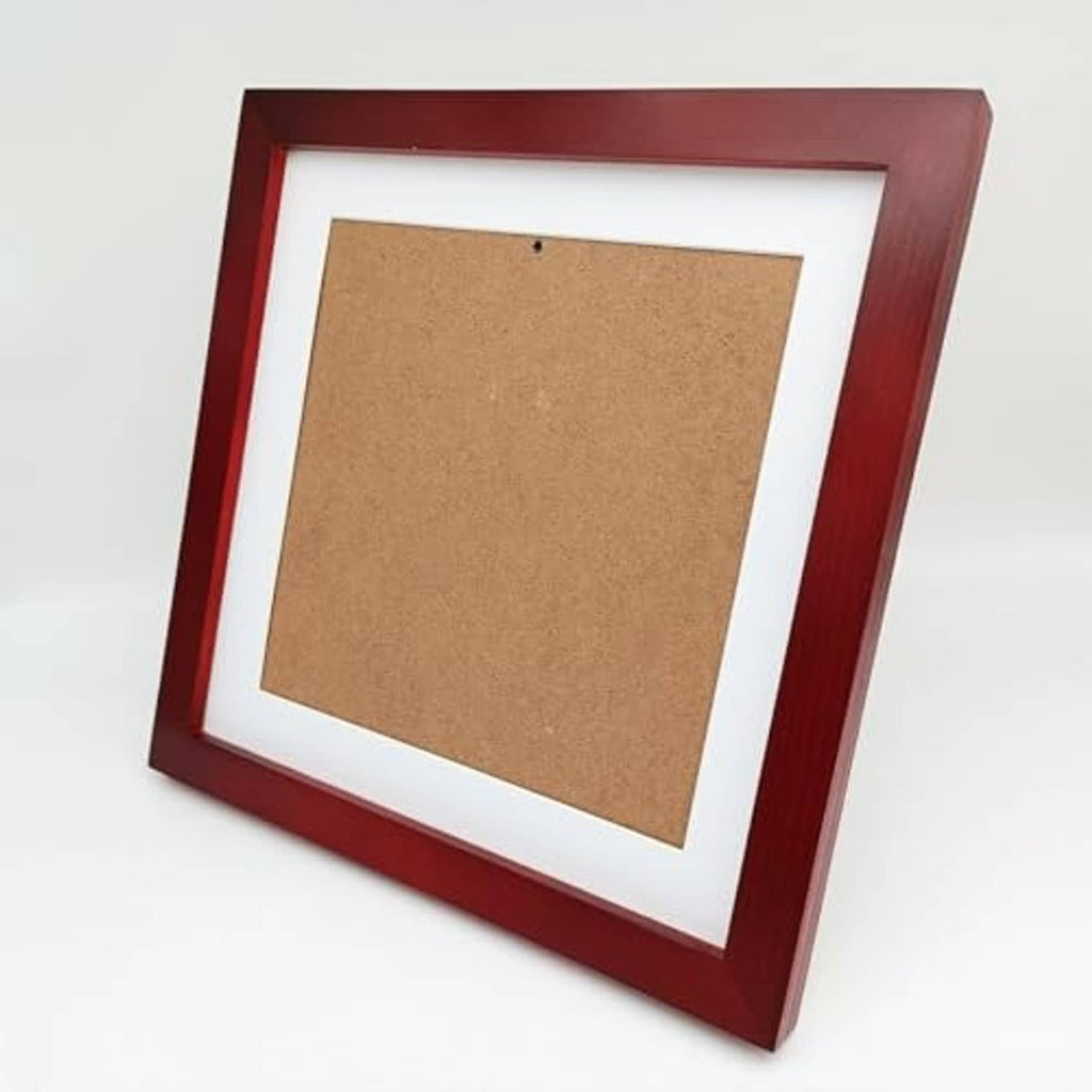 Red wood picture frame angled view with white mat and brown backing