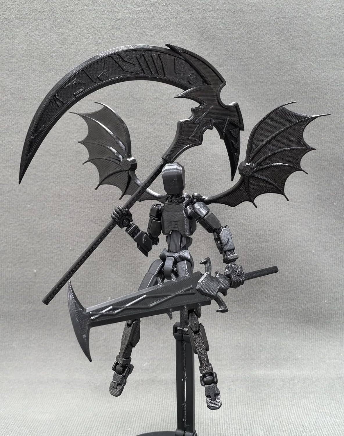 Titan 13 robot action figure with bat wings and mounted scythe, front view