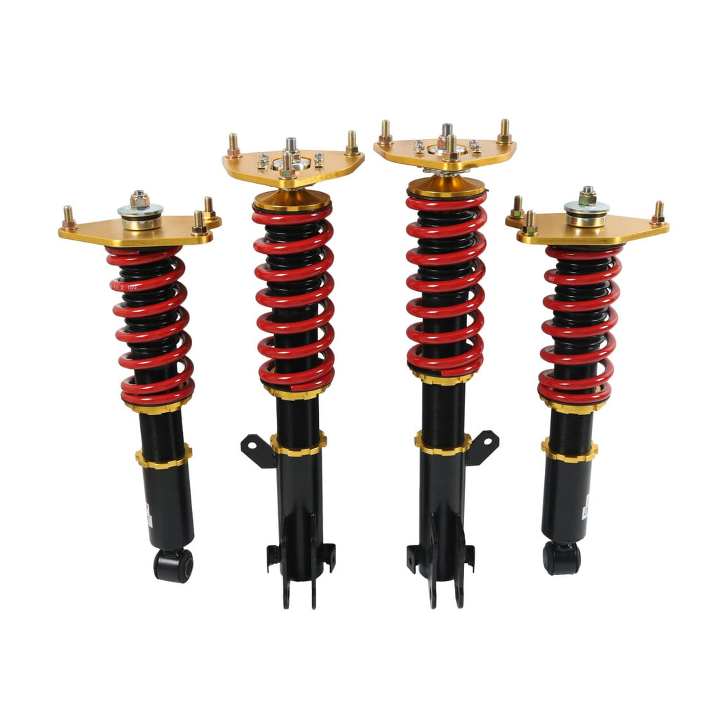 Four coilover struts with red springs, black shocks, and gold mounting plates