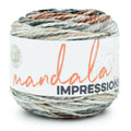 Bulky multicolor yarn ball in gray, beige, and rust-tones with Mandala Impressions label