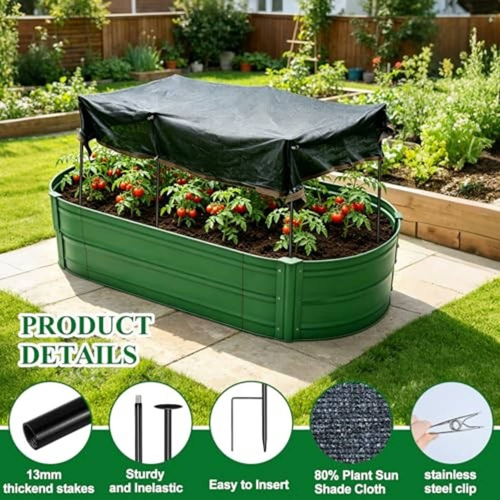 Green raised garden bed covered by dark shade net canopy over seedlings