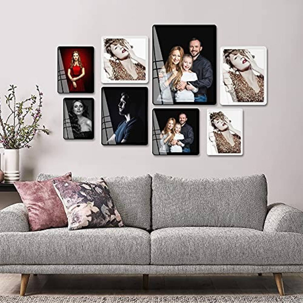 White 8x10 picture frames collage on wall featuring multiple portrait photos.