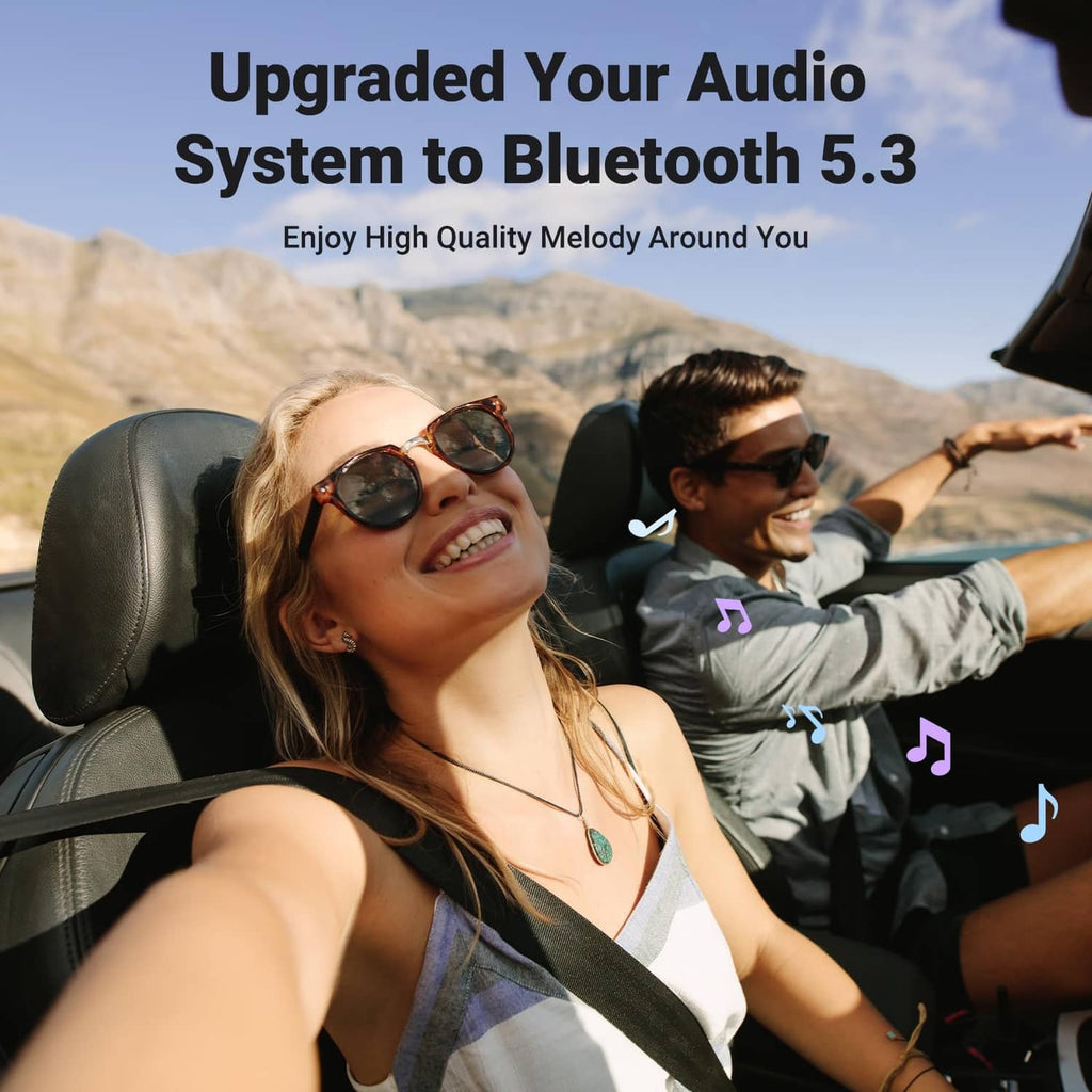 Bluetooth aux adapter mounted in car dashboard with connected cable and mic