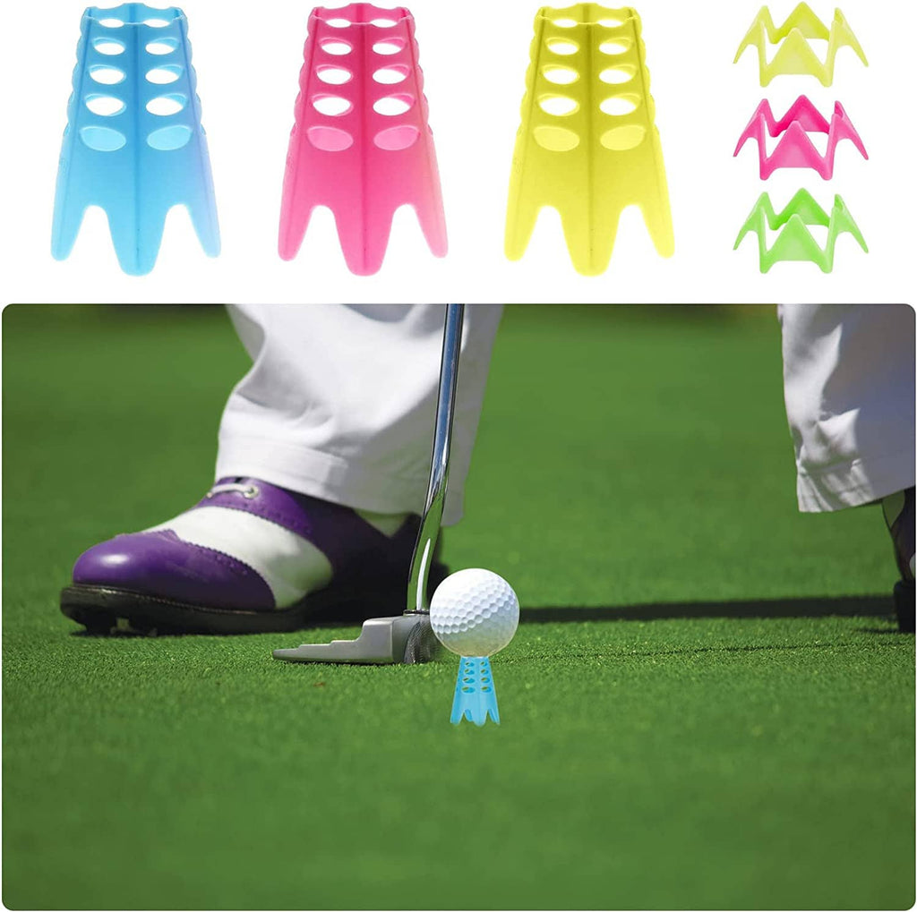 Colorful plastic golf practice tees on indoor turf; ball resting on a blue tee