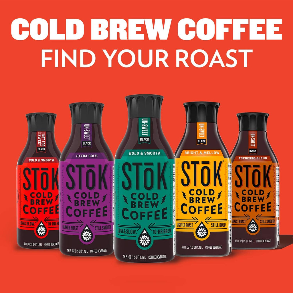 Cold brew coffee bottles lineup with bold roast labels on a red background