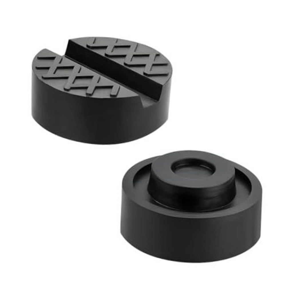 Pair of black rubber jack pads with textured grip channels and cross pattern.