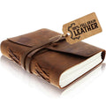 Vintage leather journal notebook with stitched cover and wrap-around closure strap.