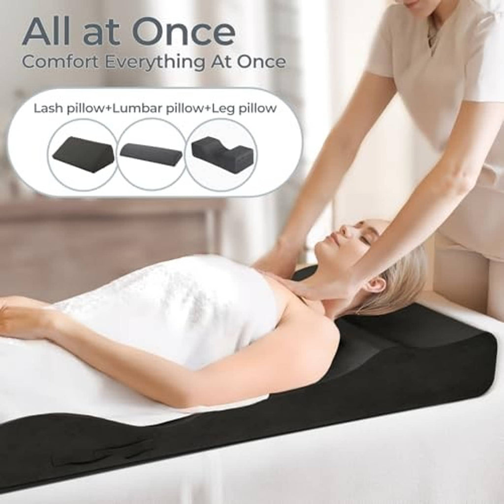Black lash bed topper on massage table, contoured cushion for supportive positioning
