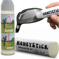 HoneyStick anti-slice gel tube with gray cap, held near a golf club head