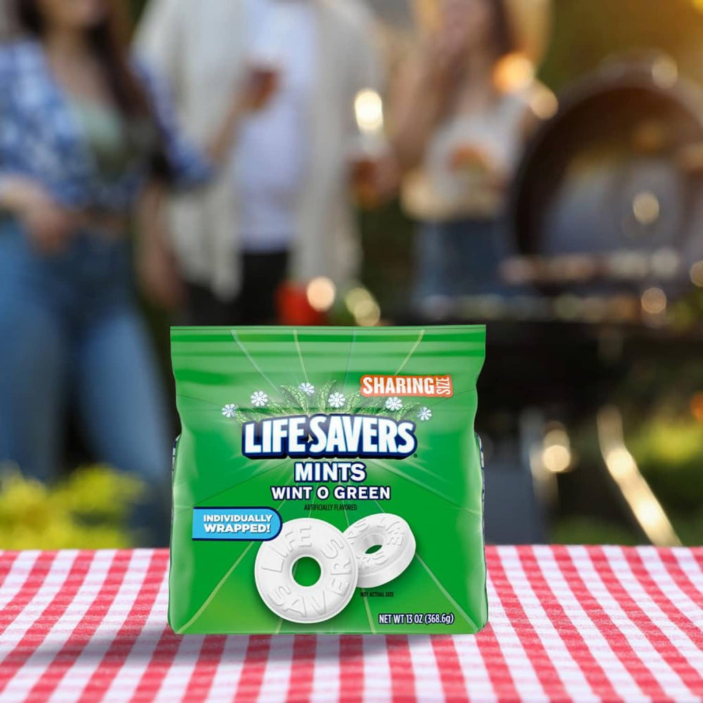 Green sharing-size bag of hard candy mints on a striped tablecloth
