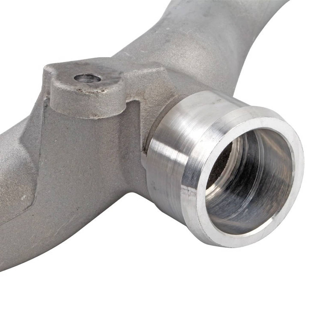 Close-up of silver coolant pipe with threaded outlet and machined metal fitting