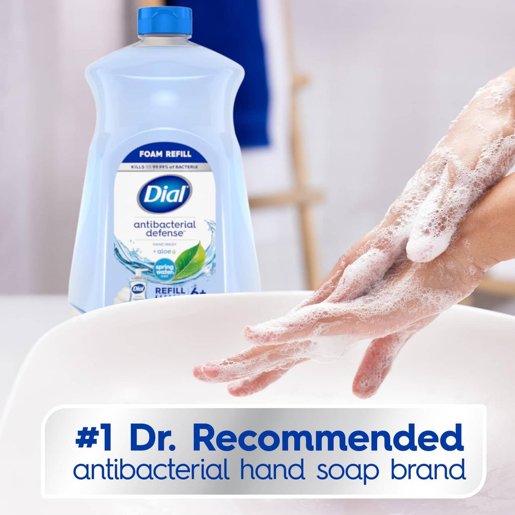 Dial antibacterial foaming hand soap refill bottle with foamy hands in foreground
