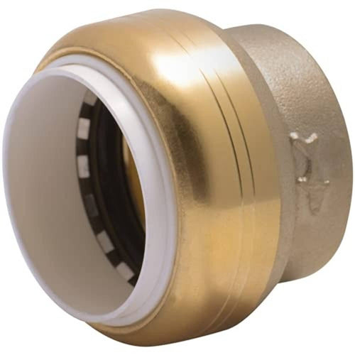 Brass and gray push-to-connect PVC cap with white inner opening sealing rim