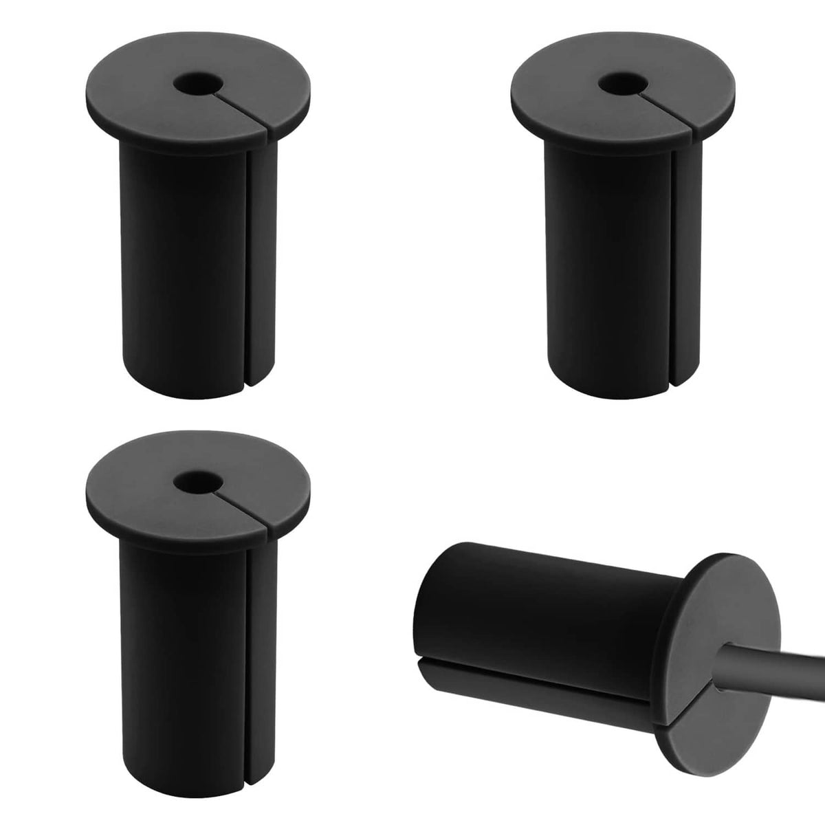 Four black silicone cable grommets with round caps and center holes, plus one cable unit