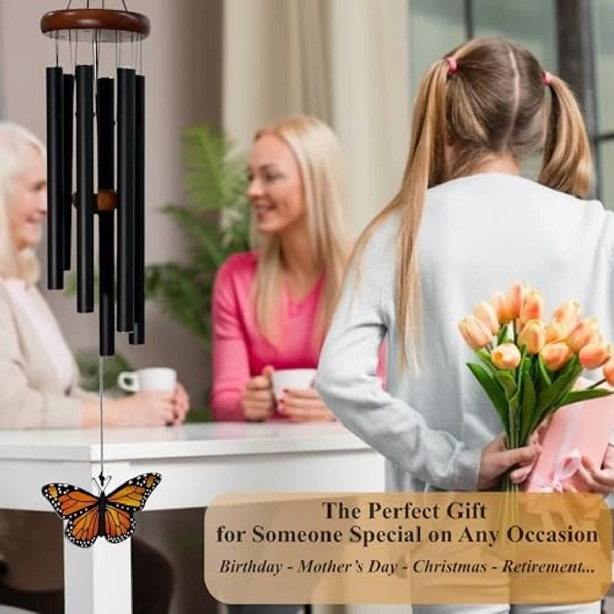 Outdoor monarch butterfly wind chime with black tubes hanging near a table
