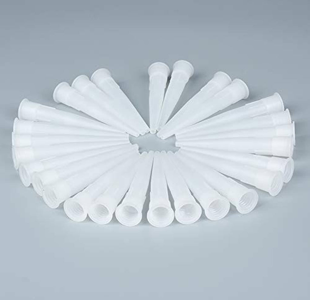 Assorted white plastic caulk nozzle tip extenders fanned out