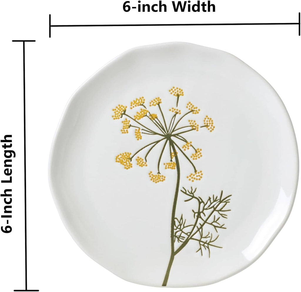 White appetizer plate with gold dandelion-style wildflower and green stems