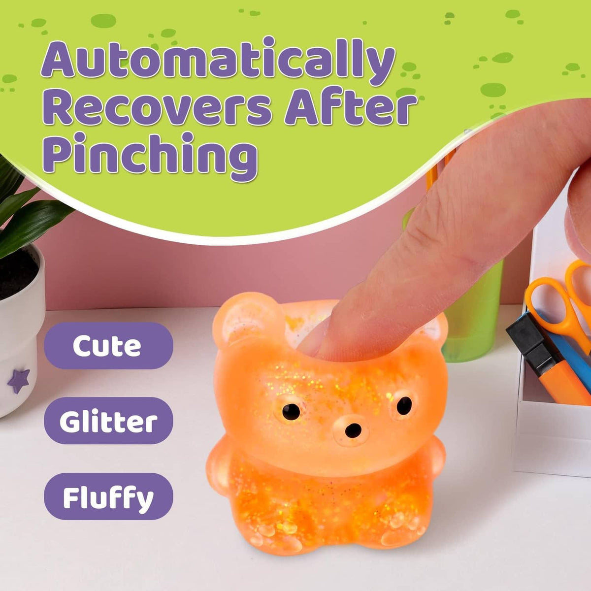Orange glitter bear squish stress ball with black button eyes