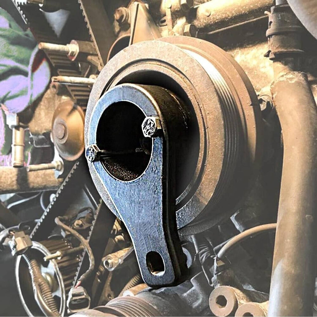 Metal crankshaft damper pulley with black holding tool secured