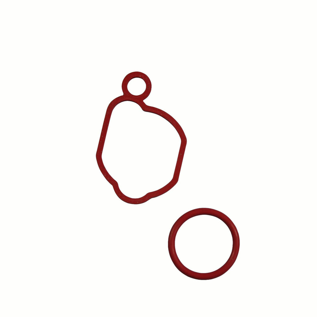 Red gasket set with two shaped seals for carburetor mounting