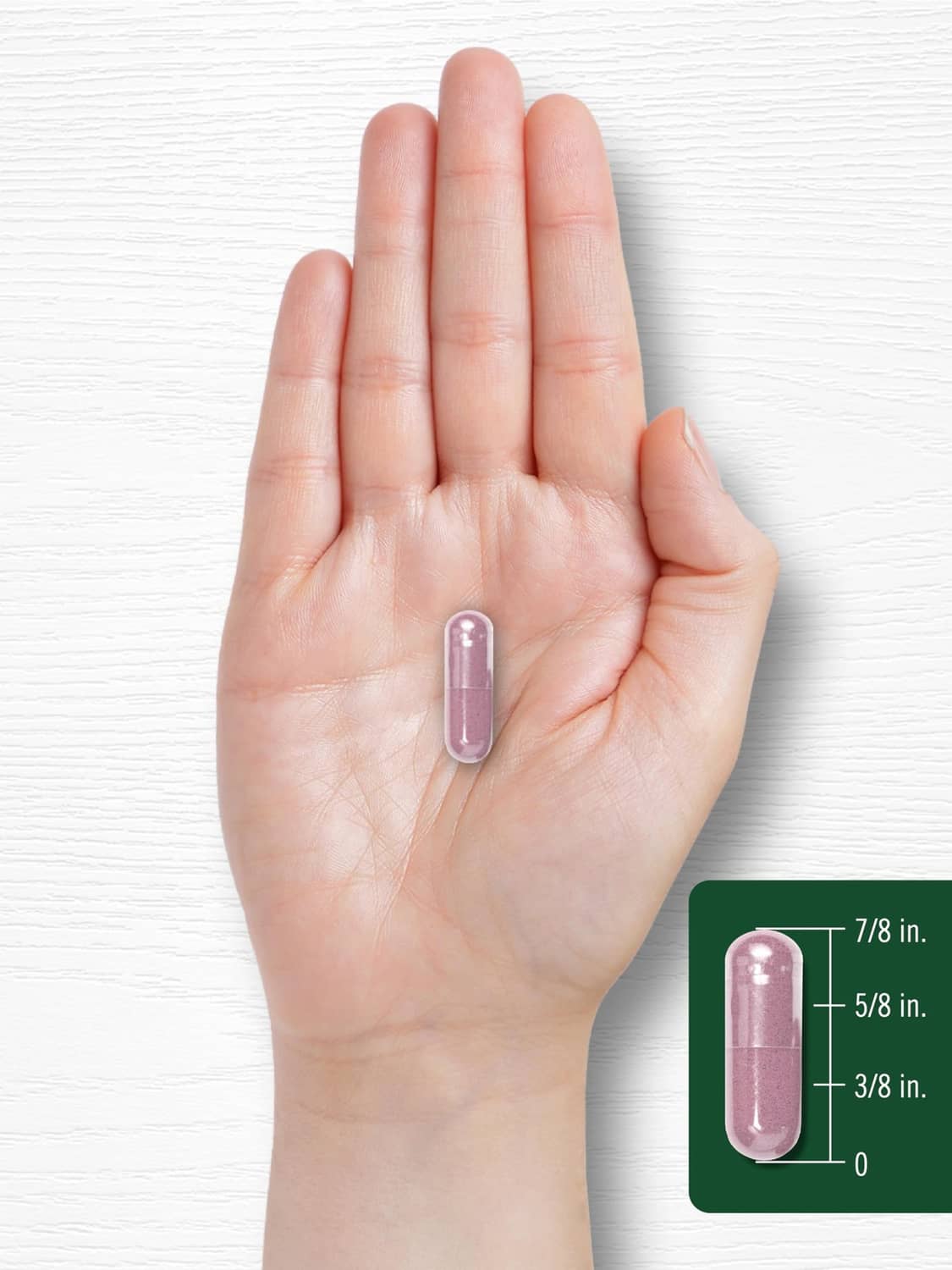 Transparent softgel capsule in hand, with size measurements shown