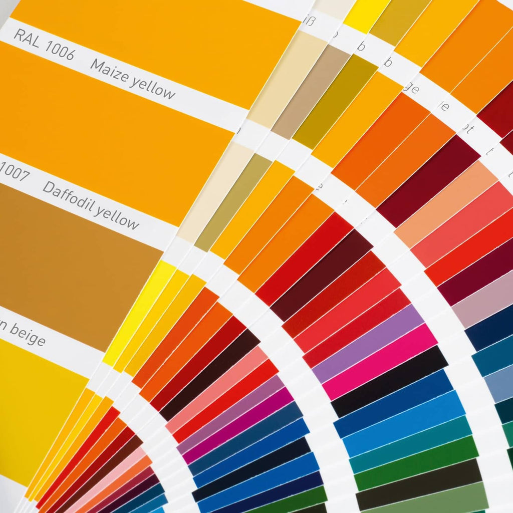 Close-up of glossy color swatches in yellow, orange, red, and brown tones