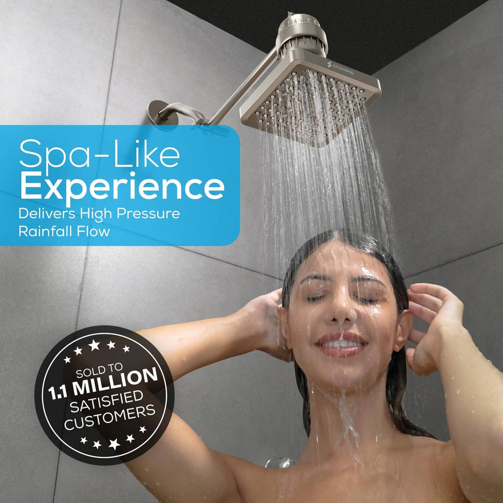 Brushed nickel square rain shower head delivering full-body rainfall spray