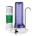Countertop water filter housing with purple clear canister and chrome faucet spout