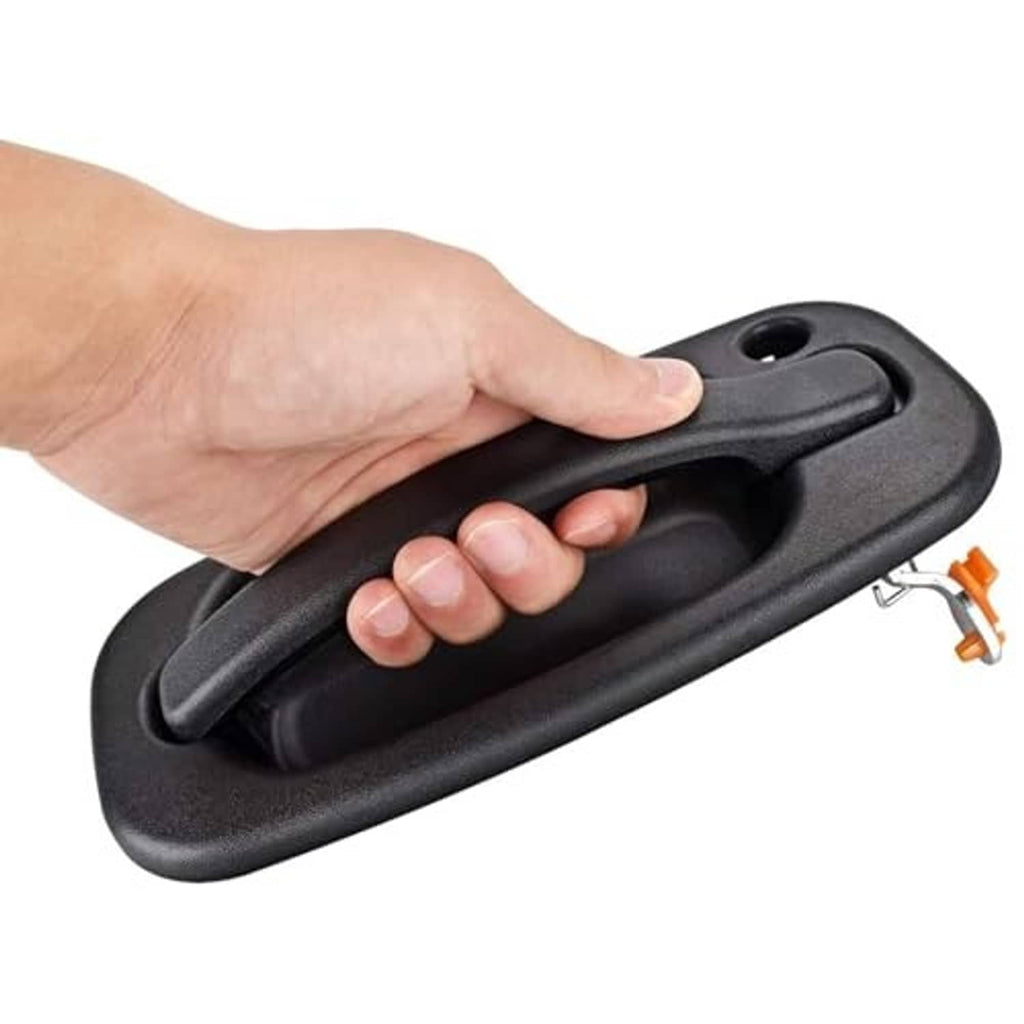 Exterior door handle held by hand, matte black grip with key hole opening
