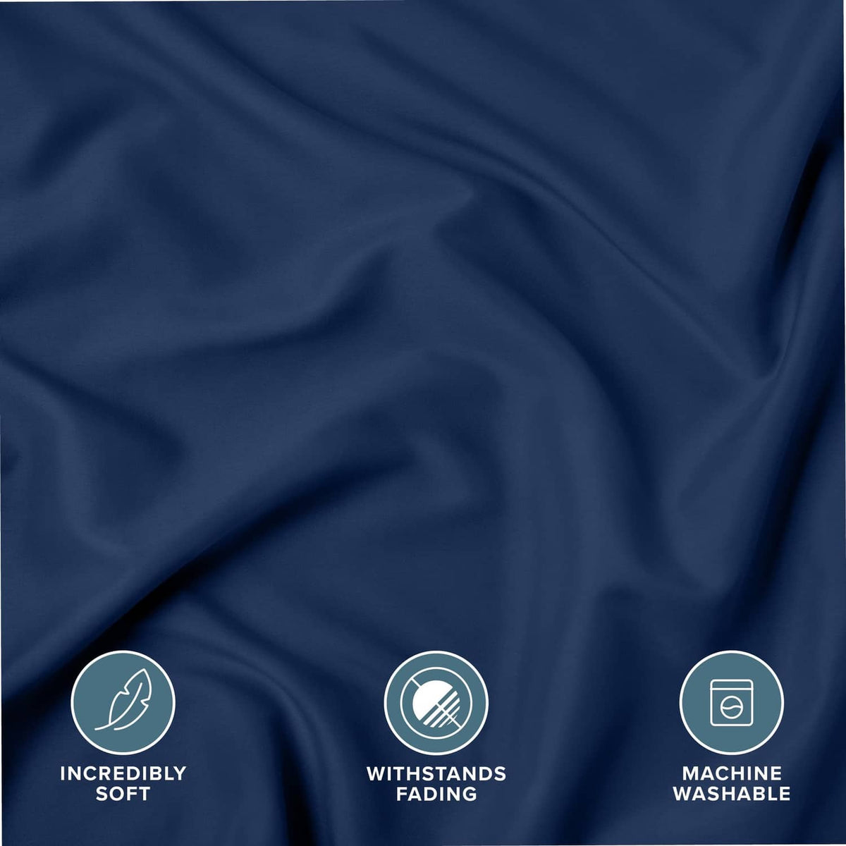 Dark blue microfiber pillow sham fabric close-up with soft, wrinkle texture