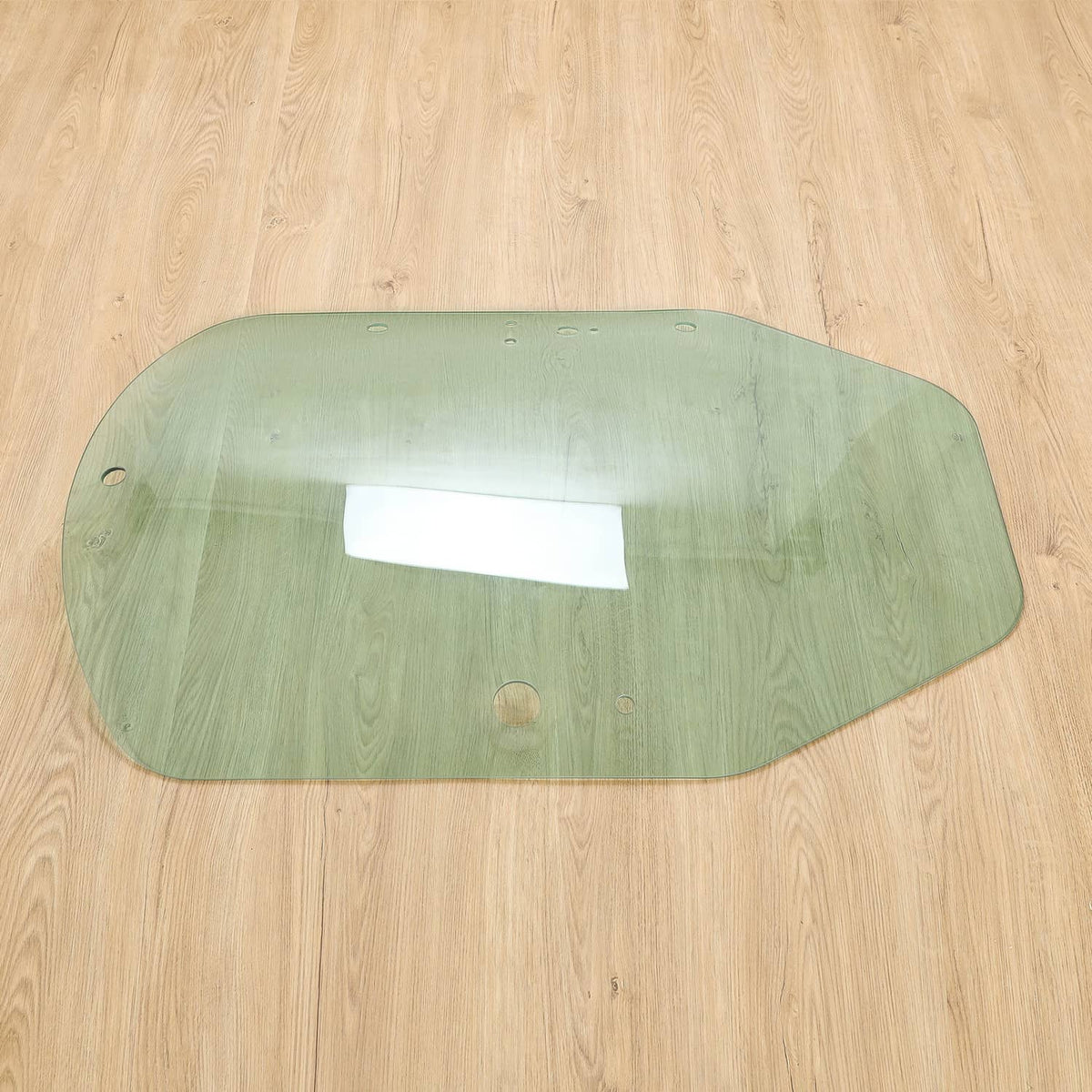 Green-tinted cab door glass with central window cutout and top mounting holes