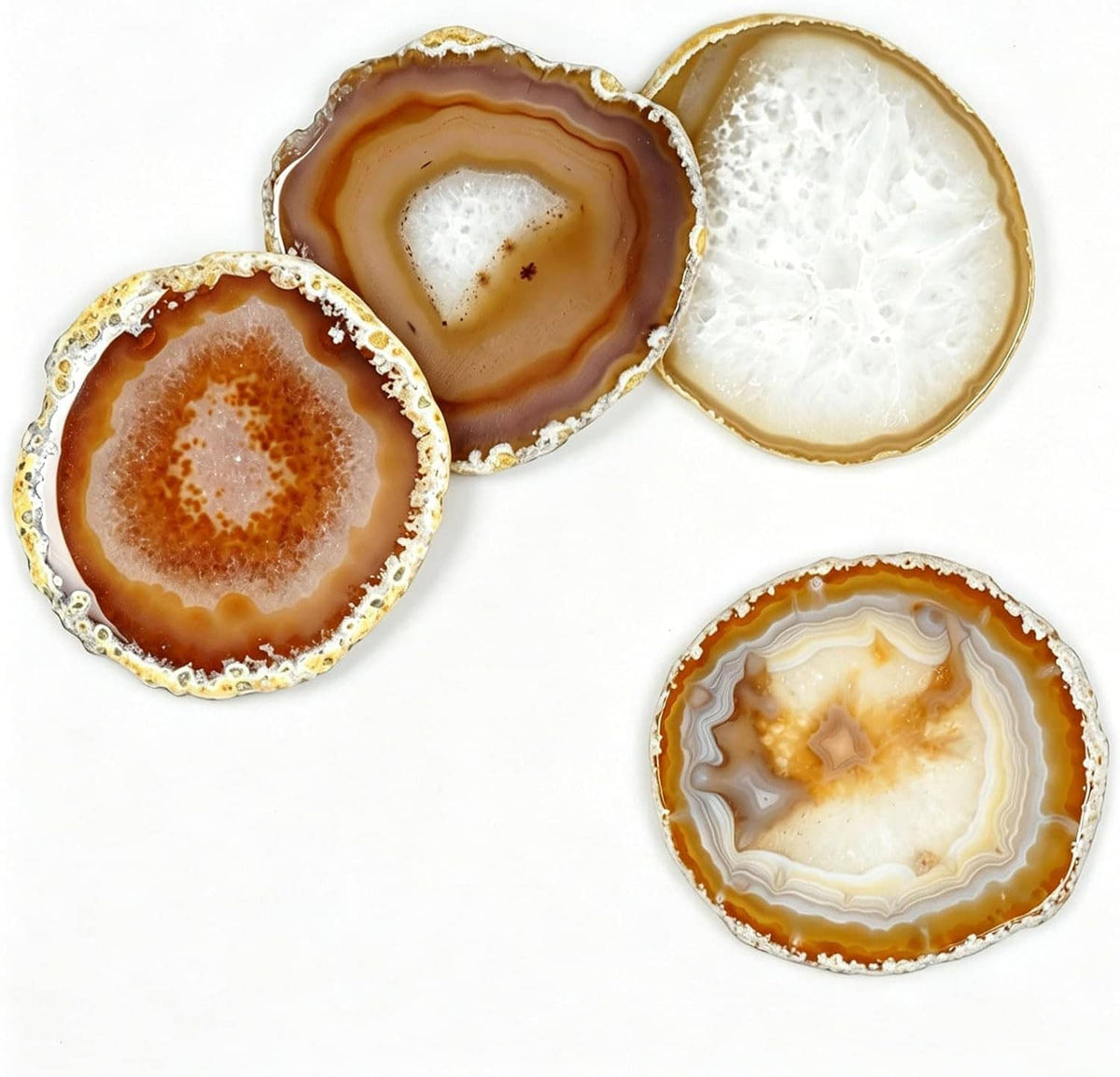 Four agate geode coasters with natural stone textures and gold-edged rims