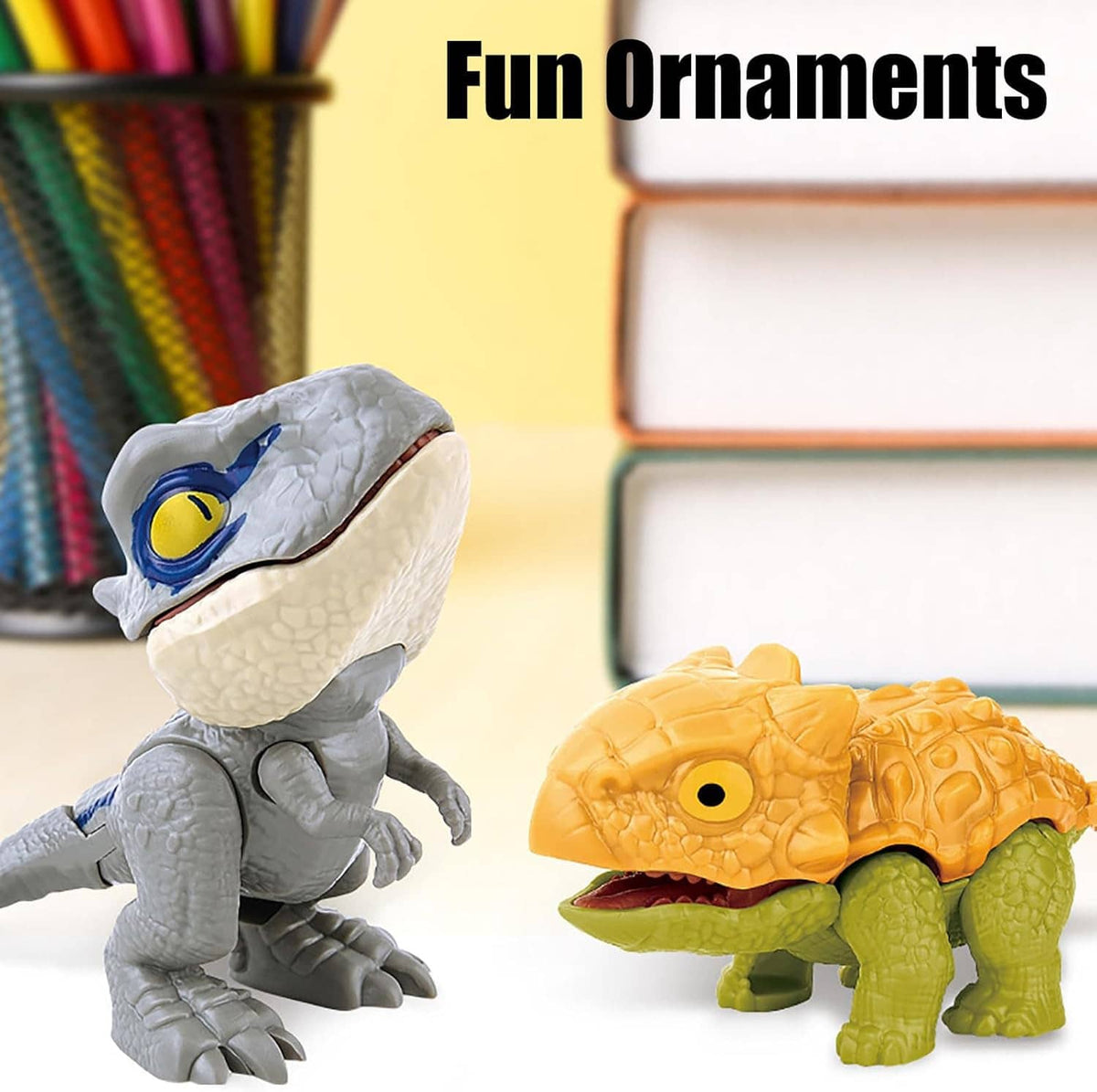Gray and orange biting finger dinosaur toy figures with molded teeth and eyes