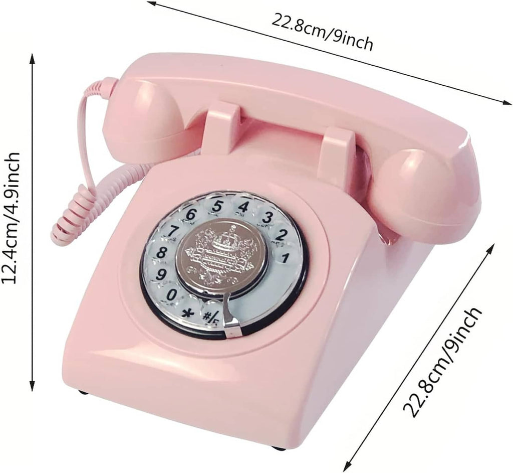 Pink corded rotary dial telephone with handset and dimension markings