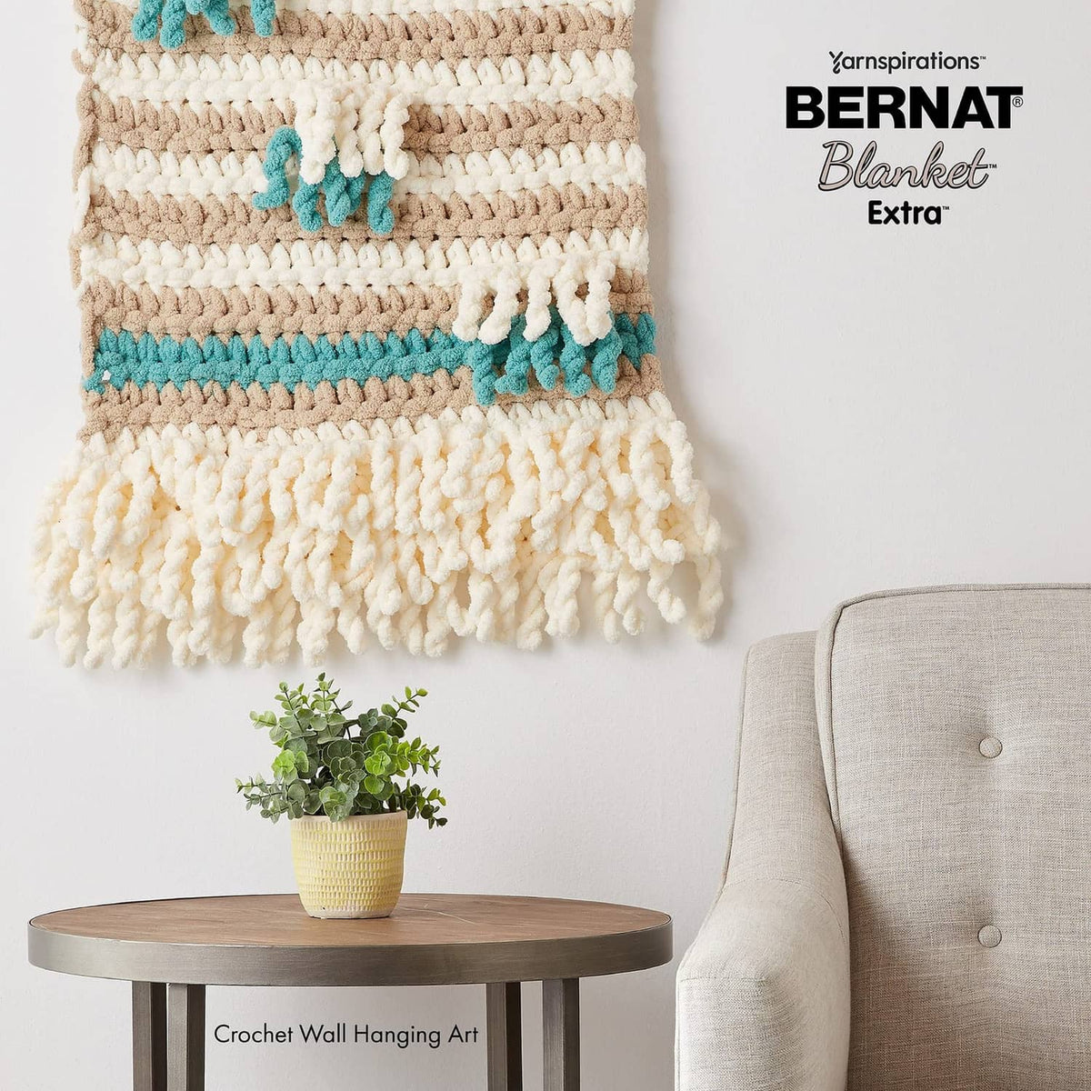Cream and teal chunky crochet wall hanging with hanging yarn tassel trim