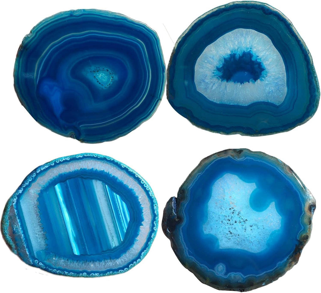 Four teal blue agate geode coasters, round slices with layered rings and crystal centers